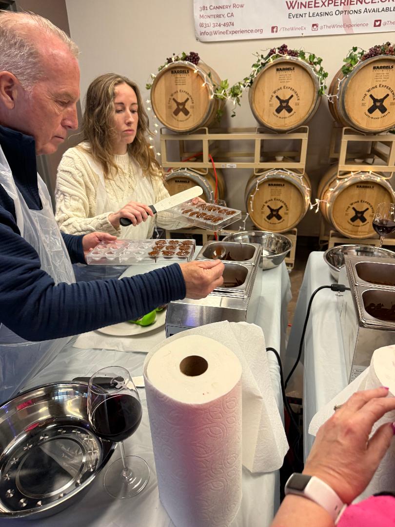 Guests making chocolate truffles at The Wine Experience on Cannery Row